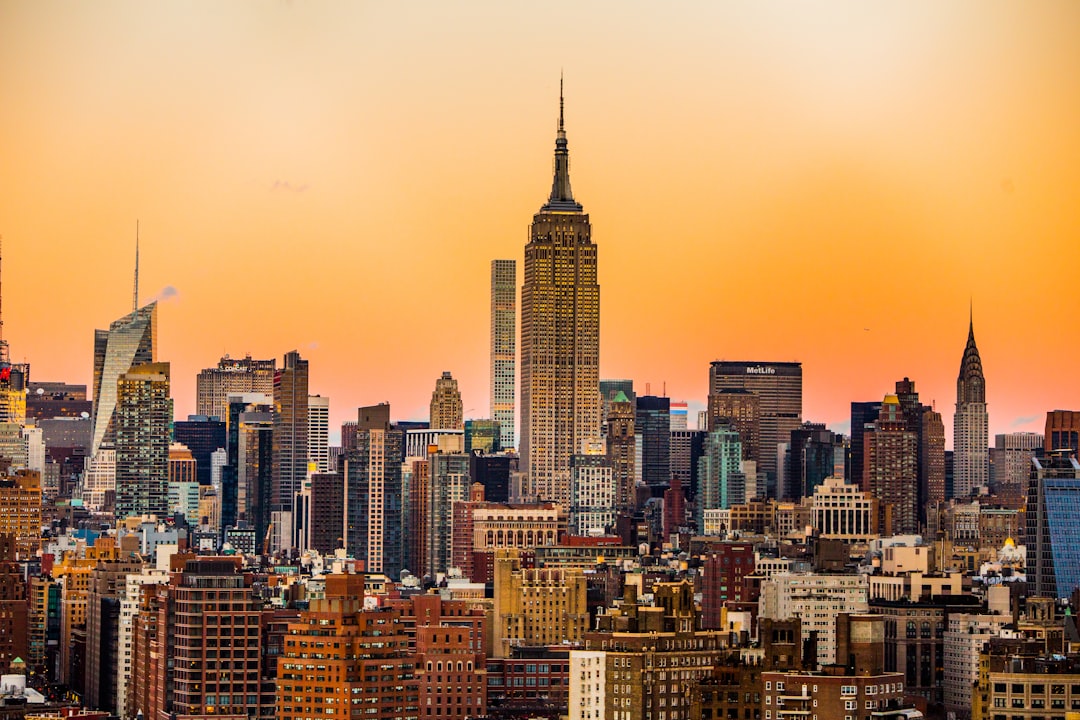 This was taken from the roof of 375 Hudson in the West Village looking up toward Midtown on a cold January evening just after sunset. by Aquarium Music landscape photo of New York Empire State Building